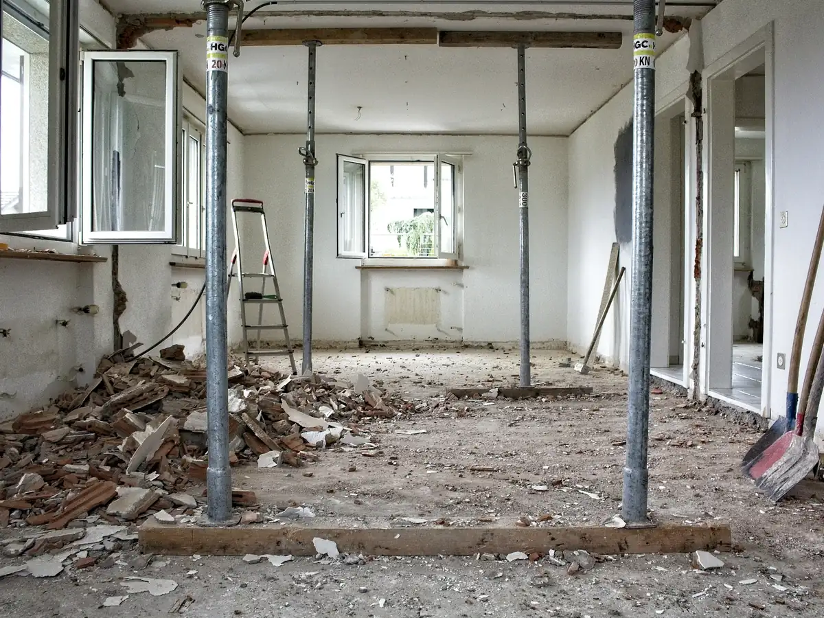 Before: a stripped room propped up with steel posts
