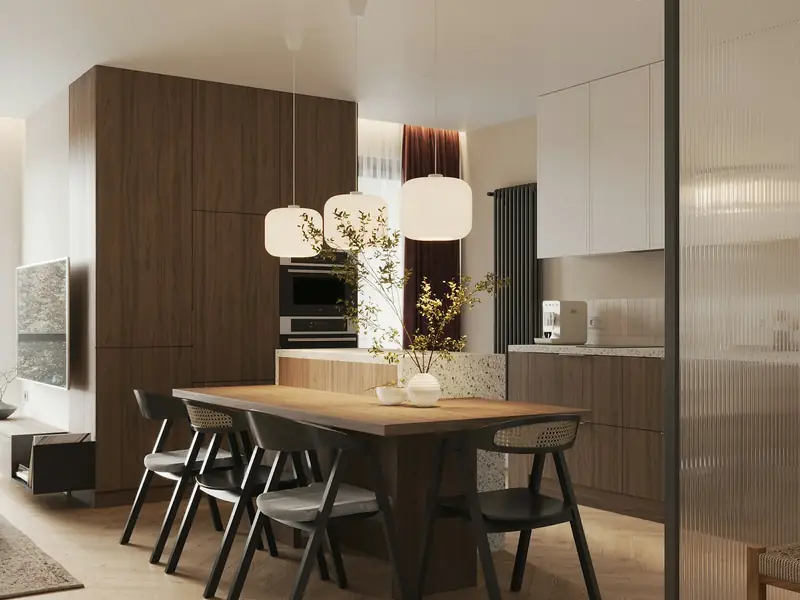 A renovated open-plan flat with a dining table and kitchen